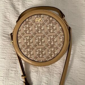 Anne Klein tan, round, crossbody purse. New